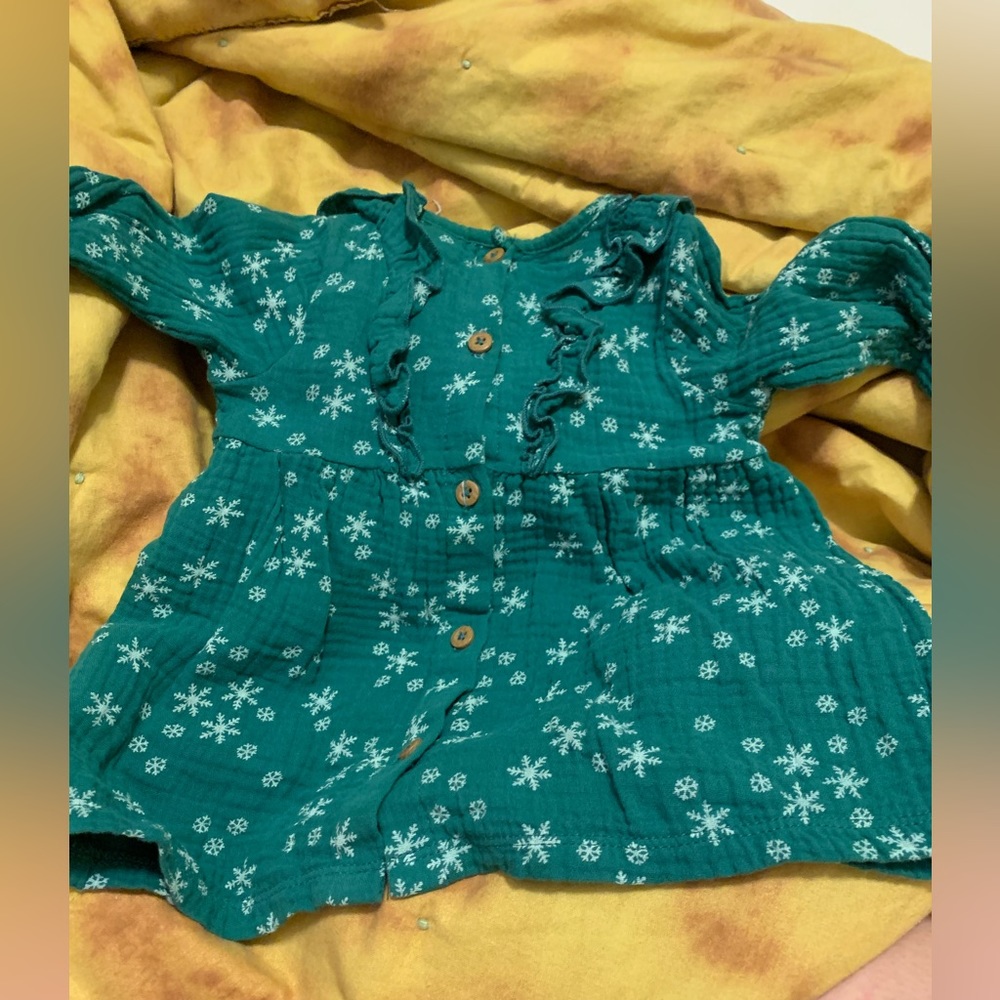 A rabbit and bear dress. Dark green with snow flakes